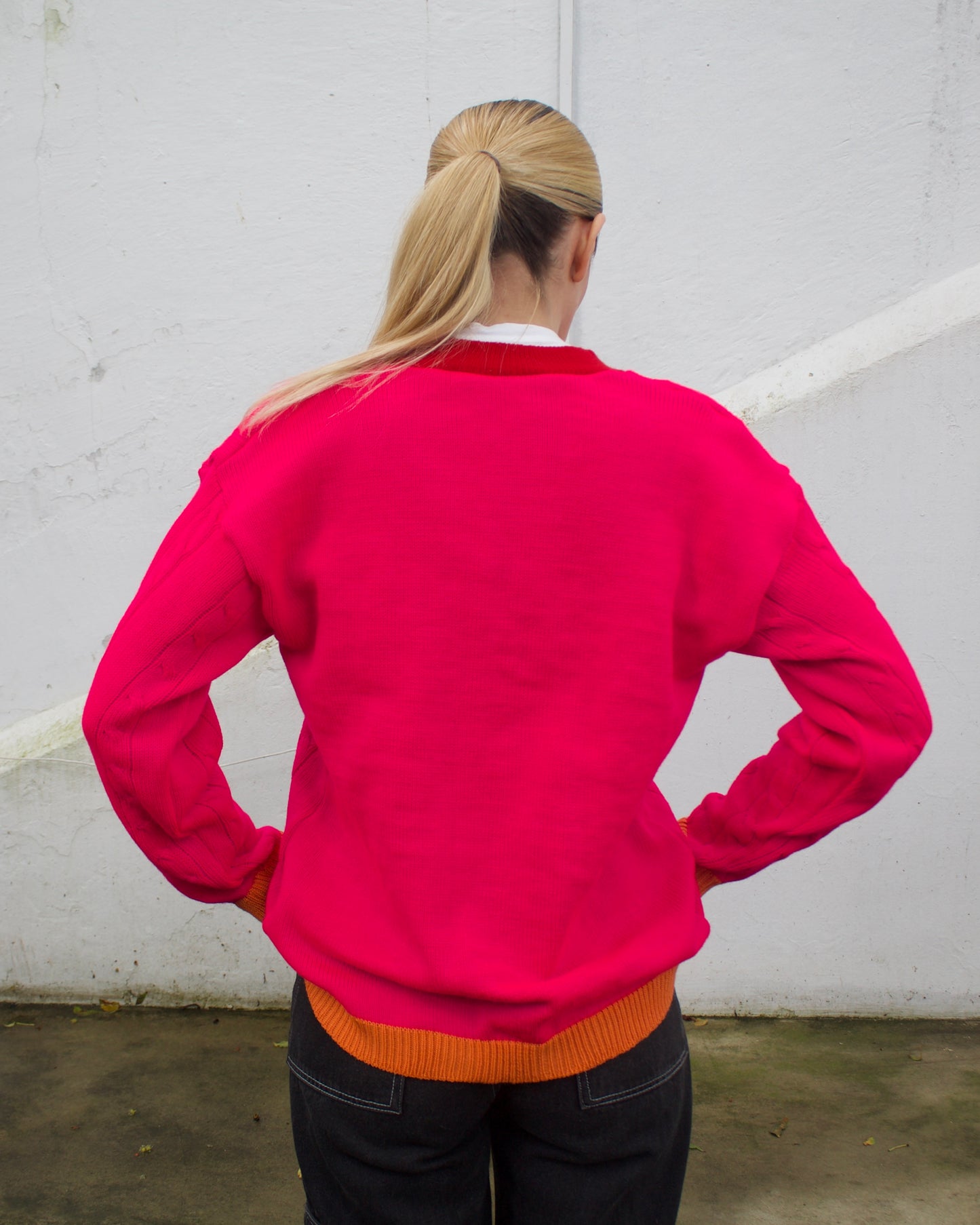 Saco tejido fucsia con naranja